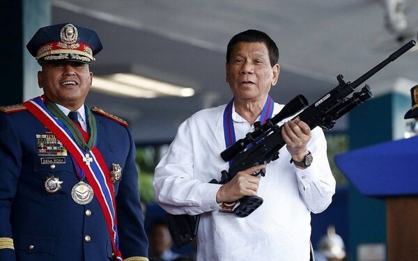 Former Philippine President Charged with Killing Thousands